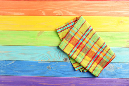 Napkin on colorful wooden table, close upの写真素材