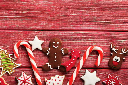 Christmas cookies on a red wooden tableの写真素材