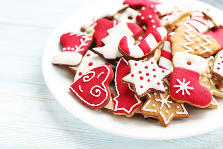 Christmas cookies in plate on a blue wooden tableの写真素材