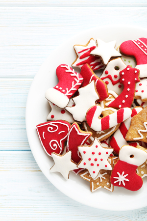 Christmas cookies in plate on a blue wooden tableの写真素材