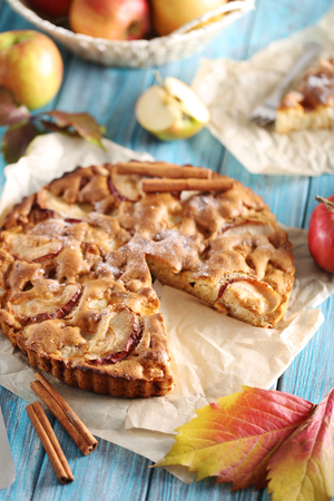 Homemade apple cake on blue wooden tableの写真素材
