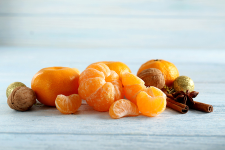 Ripe mandarins on a blue wooden tableの写真素材