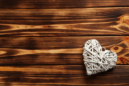 Love heart on a brown wooden backgroundの写真素材