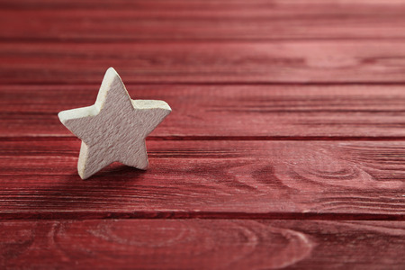 Decorative star on a red wooden backgroundの写真素材