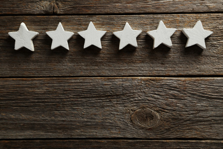 Decorative stars on a grey wooden background