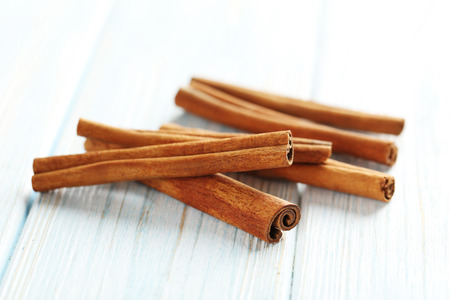 Cinnamon on a blue wooden backgroundの写真素材