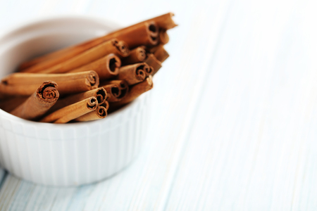 Cinnamon on a blue wooden backgroundの写真素材