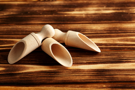 empty wooden scoop on a wooden tableの写真素材