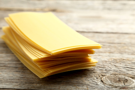 Lasagne sheets pasta on a grey wooden table