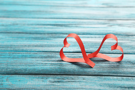 Love hearts on a blue wooden tableの写真素材