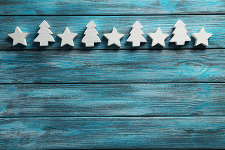 Decorative stars and fir-tree on a blue wooden backgroundの写真素材
