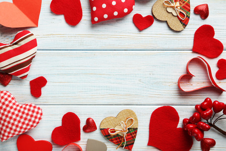 Love hearts on a blue wooden tableの写真素材