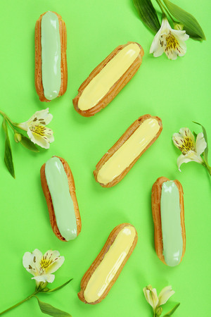 Eclairs with glaze on a paper backgroundの写真素材