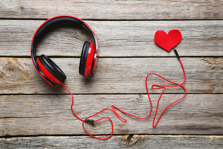 Headphones on a grey wooden table, close upの写真素材