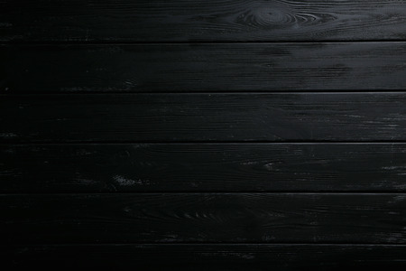 Black wooden background, close upの写真素材