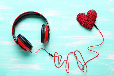 Headphones on a mint wooden table, close upの写真素材