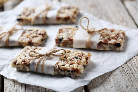 Granola bar on a grey wooden tableの写真素材