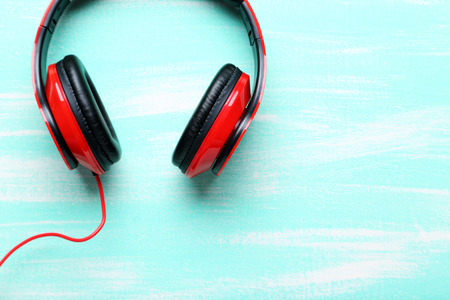 Headphones on a mint wooden table, close upの写真素材