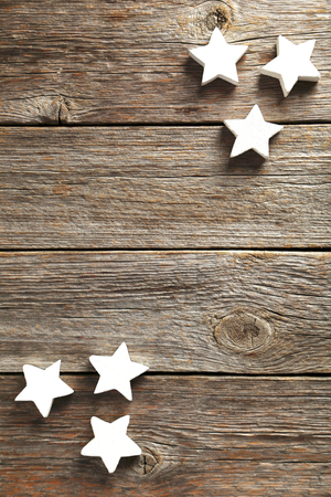 Decorative stars on a grey wooden backgroundの写真素材