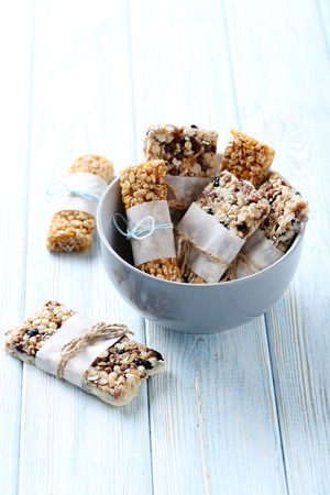 Granola bar on a blue wooden tableの写真素材