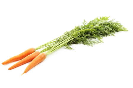 Fresh carrots isolated on a white backgroundの写真素材