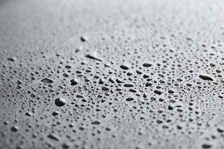 Water drops on a black backgroundの写真素材