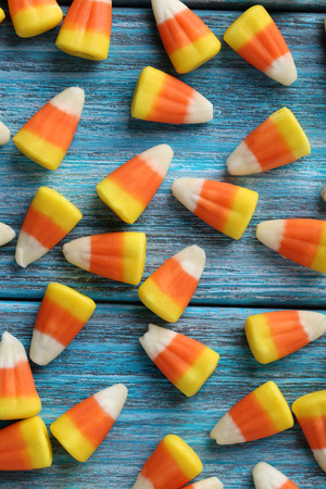 Halloween candy chorns on blue wooden backgroundの写真素材