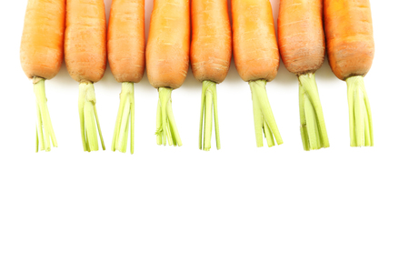 Fresh carrots isolated on a white backgroundの写真素材