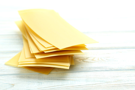 Lasagne sheets pasta on a blue wooden tableの写真素材