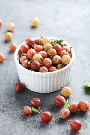 Gooseberries fruit on a grey tableの写真素材