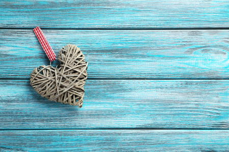 Love heart on a blue wooden backgroundの写真素材