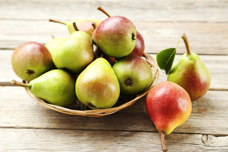 Ripe pears on grey wooden tableの写真素材