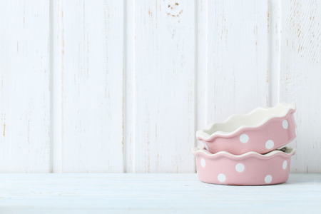 Ceramic bowl on white wooden tableの写真素材