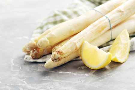 Fresh white asparagus on a grey tableの写真素材