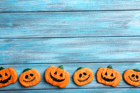 Fresh halloween gingerbread cookies on blue wooden tableの写真素材