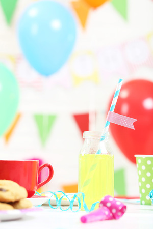 Bottle with drink on the wooden tableの写真素材