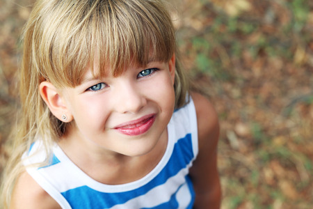 Portrait of little girl in the parkの写真素材