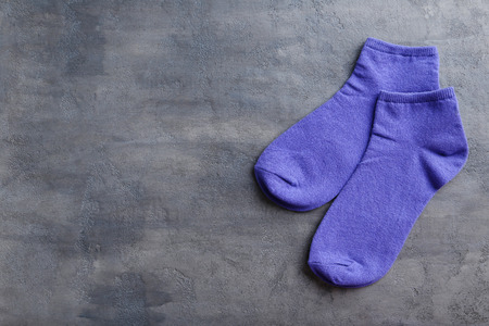 Blue socks on a grey table