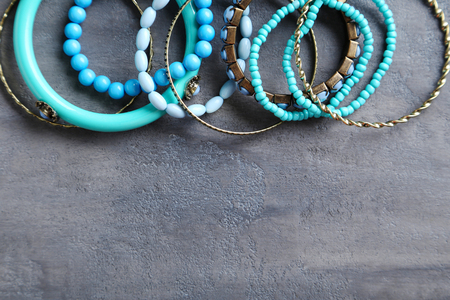 Beautiful bracelets on a grey tableの写真素材