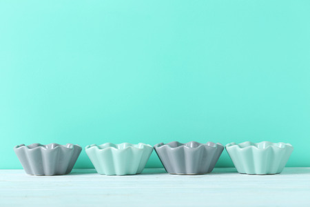 Ceramic bowl on blue wooden table