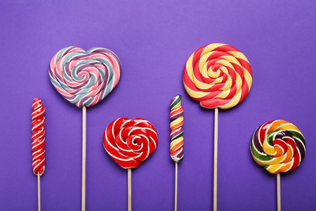 Sweet lollipop on purple backgroundの写真素材