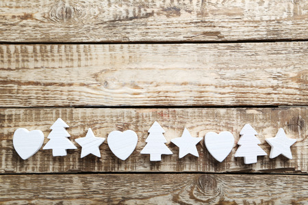 Decorative fir-tree, star and heart on a grey wooden tableの写真素材