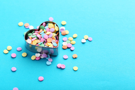 Colorful sprinkles on a blue background