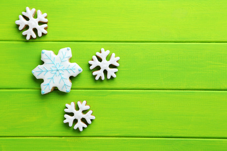 Christmas cookies on a green wooden tableの写真素材