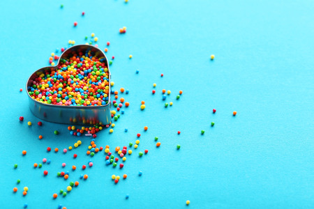 Colorful sprinkles on a blue background