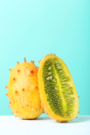 Kiwano fruit on white wooden tableの写真素材