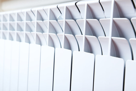 White radiator in an apartmentの写真素材