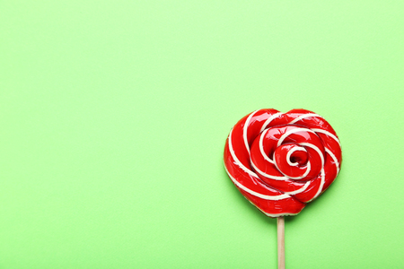 Sweet lollipop on green backgroundの写真素材