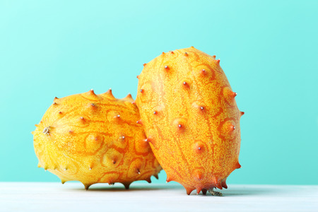 Kiwano fruit on white wooden tableの写真素材