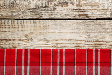 Red napkin on a grey wooden tableの写真素材